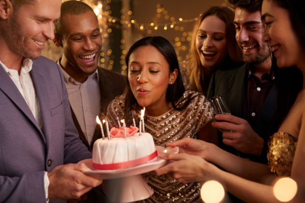 Blowing out candles on birthday cake